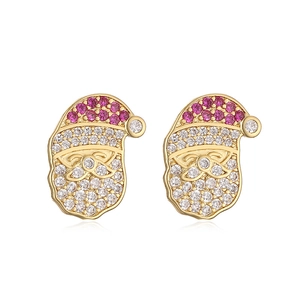 Detailed macro view of Santa Claus earrings with gold base and colorful pavé crystals