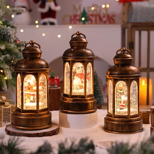 Vintage bronze Christmas lanterns with Santa and snowman, glowing LED water globes