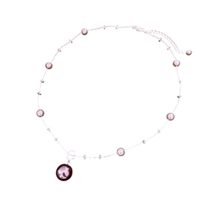 Minimalist silver chain necklace featuring multiple lavender and brown pearls on white background