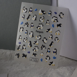 Detailed 5D embossed nail stickers featuring cute cartoon penguins and blue fish patterns