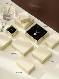 Top view of beige jewelry gift boxes with black sponge inserts in various sizes