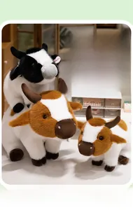 Close-up of soft plush brown and black spotted cows with three-dimensional horns