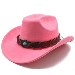 Detail of pink faux suede cowboy hat featuring woven leather band and turquoise stone