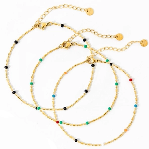 Set of three gold bohemian anklets with colorful enamel beads and lobster clasp