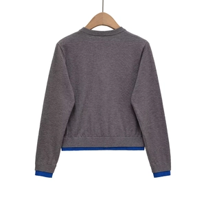 Women's crewneck knit cardigan with royal blue trim contrast and deep gray back view