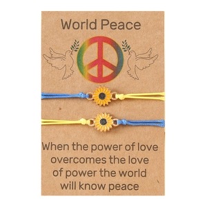 Handmade woven sunflower bracelets with Ukraine flag colors on a World Peace display card