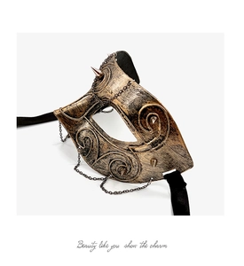 Detailed view of vintage punk half-face mask with antique gold texture and metal chains