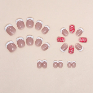 Short French press-on nails with rose red wavy lines and white tips on nude base