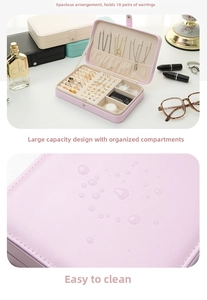 Macro shot of pink waterproof PU leather jewelry box showing multiple storage compartments