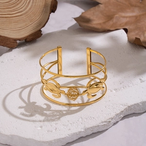 Bracciale rigido dorato con tartarughe marine e sfera intrecciata su pietra naturale