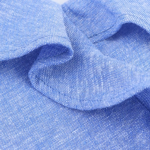 Close-up of blue dress fabric showing premium texture and high-quality stitching details