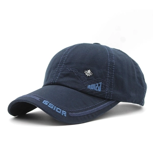 Detail of navy cotton baseball cap featuring GSIOR embroidery and metal maple leaf buckle