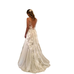 Elegant white A-line wedding dress with deep V-back, lace appliques and long tulle train