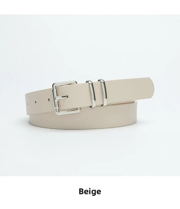 Detail of beige leather belt with rectangular silver buckle and double metal loops