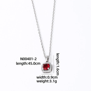 Silver necklace with oval red gemstone pendant and zircon halo on white background