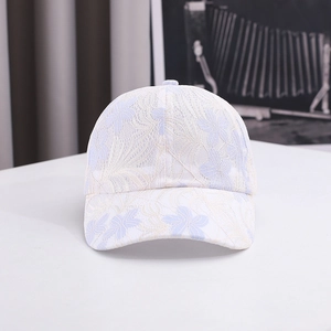 Close-up of white baseball cap with elegant light purple floral lace embroidery detail