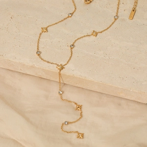 Collier en Y élégant en acier inoxydable doré avec breloques étoiles et zircons sur pierre