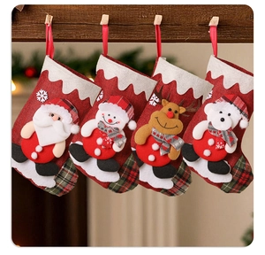 Detailed view of 4-pack linen Christmas stockings with 3D Santa, Snowman and Reindeer