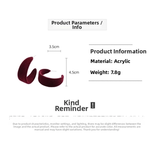 Detail of burgundy flocked C-shape acrylic hoop earrings with dimension markings