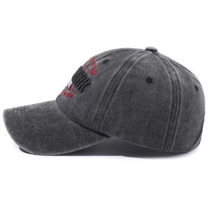 Vintage washed grey cotton baseball cap with embroidered York 1985 lettering on white background