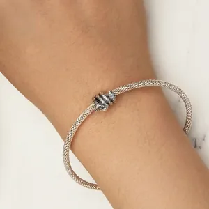 Minimalist s925 silver mesh bracelet with intricate knot design on a wrist