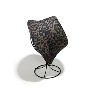 Detail of leopard print sun hat fabric texture and flat stitching on the brim