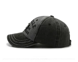 Detail of vintage gray washed denim baseball cap featuring VILLE 84 WARD embroidery