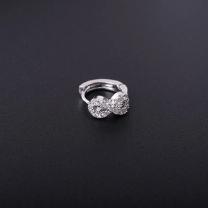 Macro shot of silver infinity hoop earring with sparkling micro-pave cubic zirconia
