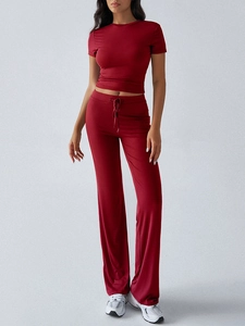 Detail of dark red two-piece set featuring short sleeve T-shirt and drawstring straight pants