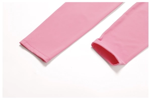 Detail shot of pink yoga set showing reinforced double-stitched hem and soft elastic fabric