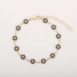 Detail of gold daisy bracelet featuring 12 blue flowers with yellow centers and clasp