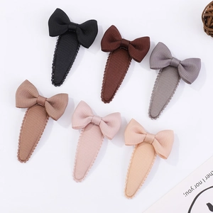 Set of 6 grosgrain ribbon bow hair clips in Morandi colors on white background