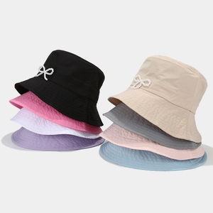 Breathable sun bucket hat with pearl bow ornament available in various pastel colors