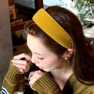 Fashionable mustard yellow velvet wide headband for women in a minimalist retro design