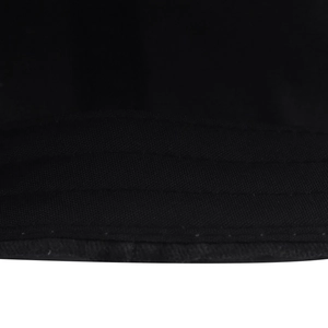 Close-up of triple stitching on washed black denim baseball cap brim and fabric texture