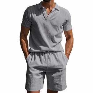 Detail of light gray linen-textured men's polo shirt and drawstring shorts summer set