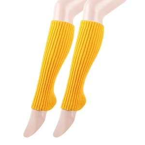Detail of bright yellow ribbed knit leg warmers with open heel design for yoga and dance