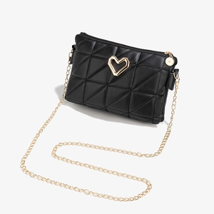 Black quilted crossbody bag with golden heart detail and chain strap on white background