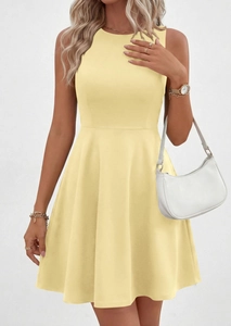 Detail of round neck and sleeveless cut on a slim fit light yellow summer A-line dress