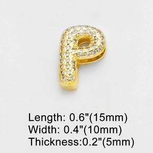 Detail view of gold letter P charm with white zircons showing 15mm length measurement