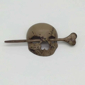 Faux bone skull hair pin with bone-shaped stick slide for Halloween hair styling