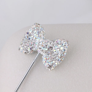 Bowtie brooch with iridescent rhinestones on a silver pin for DIY jewelry making