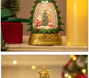 Close-up of a festive Christmas tree snow globe featuring Santa Claus and warm LED lights