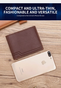 Detailed view of brown lychee grain leather bifold wallet with yellow stitching on wood
