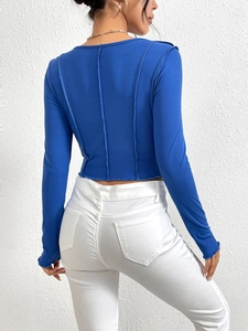 Royal blue slim fit ribbed knit long sleeve top back view with white jeans