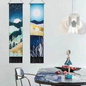 Artistic gold landscape tapestries set with mountain patterns and black fringe tassels