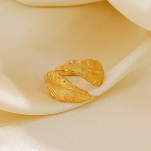 Adjustable gold plated stainless steel feather open ring on champagne silk background