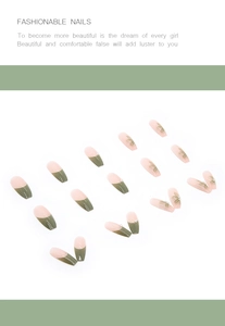 Detail of press-on nails set with 3D white flowers, pearls, and French green tips