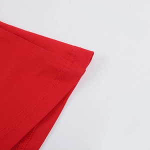 Detail shot of high-quality double-needle stitching on red bodycon strap dress hem