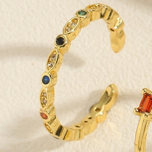 Macro detail of adjustable gold plated ring with colorful zircon stones in marquise shape